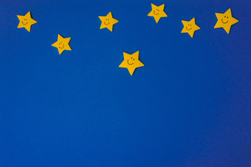 Yellow stars against the blue night sky. Application paper on the right. Copy space