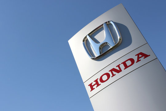 WIEHL, GERMANY - August 27, 2016: Honda dealership sign against blue sky. Honda is the second-largest Japanese automobile manufacturer.