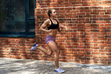 healthy strong woman spending time on running, full length side view photo.strength training.