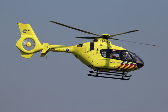 SANKT AUGUSTIN, GERMANY - APRIL 9, 2015: ANWB Medical Air Assistance Eurocopter EC-135T2+ with registration PH-MAA departing after maintenance at Bonn Hangelar Airport.