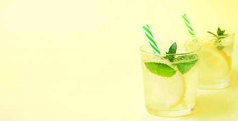 Lemonade or mojito cocktail with lemon and mint