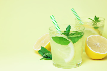 Lemonade or mojito cocktail with lemon and mint