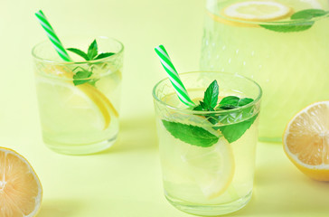 Lemonade or mojito cocktail with lemon and mint