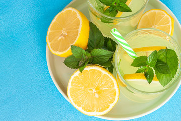 Lemonade or mojito cocktail with lemon and mint