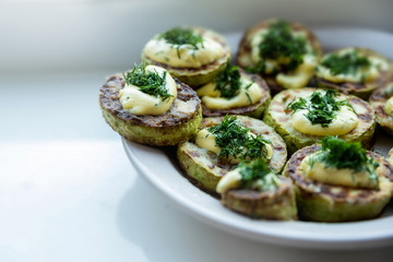 homemade zucchini fried with mayonnaise. On a white background