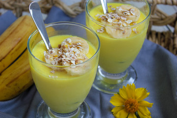 Glasses with delicious banana pudding on tray for breakfast