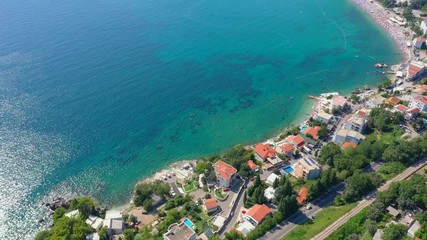 Flying over the seacoast to the turquoise sea