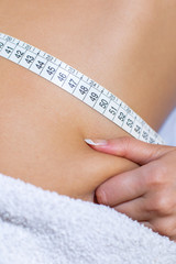 taking measures of woman's waist