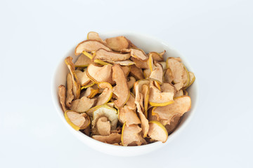 Apple quince chips in a white bowl isolated