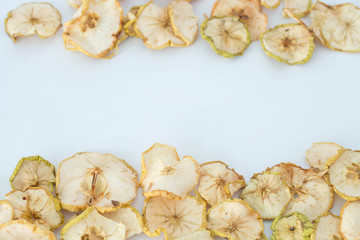 Background of apple chips on the white