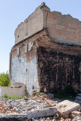 Ruined house. Remains of old houses. Apocalypse. Abandoned city. City of ghosts. Ruins of old historic houses destroyed by an earthquake and devastating operation of urban structures. Broken building