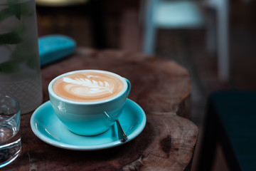 Cup of coffee on a wooden table