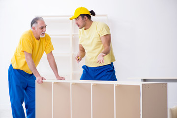 Two contractors carpenters working indoors