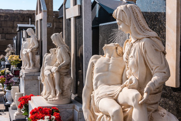 Roman Catholic cemetery with ornate carved marble and granite headstones, Xwekija, Gozo, Malta.