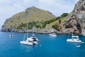 Fototapeta na wymiar Yachts in the Bay of Sa Colobra in Mallorca