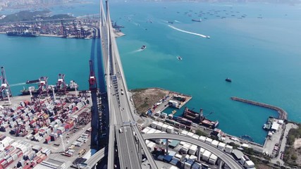 Aerial lengthwise perspective of large Stonecutters bridge at Hong Kong. Major structure, part of Lantau Link project, span across Rambler Channel. Camera fly forward, showing aerial panorama