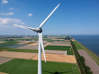 Drone photo of a large windmill with a total height of 198 meters with a shaft height of 135 meters. In the background, the wieringermeer polder..Photo taken at an altitude of 160 meters