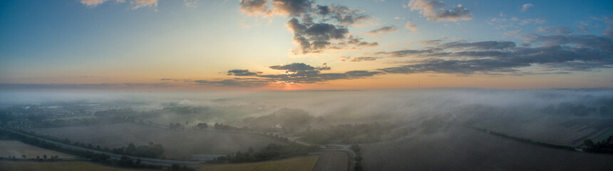 Naklejka na ściany i meble Nebel bei Sonnenaufgang