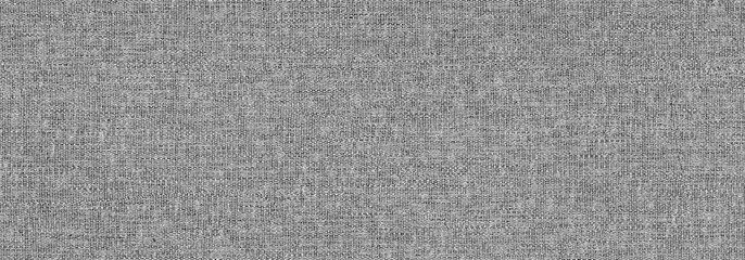 Fototapeta na wymiar The Grunge texture of the wrong side of knitted fabric. Monochrome background of wavy knit fibers with spots, halftone and noise. For posters, banners, retro and urban design