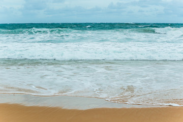 Fototapeta na wymiar Sea Beach and Soft wave of blue ocean. beautiful summer background with sandy beach