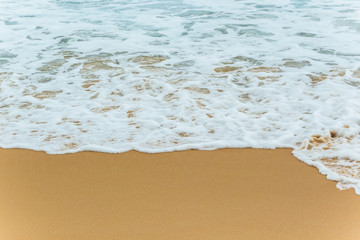Sea Beach and Soft wave of blue ocean. beautiful summer background with sandy beach