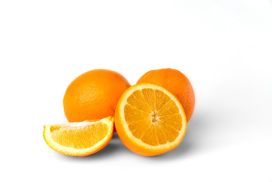 Sliced oranges fruit segments isolated on white background