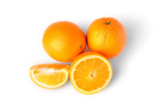 Sliced oranges fruit segments isolated on white background Top view