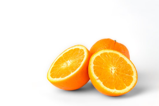 Orange fruit with slice isolated on white background.