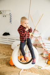 Halloween boy with pumpkin.