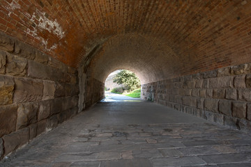 Long stone walled urban tunnel image