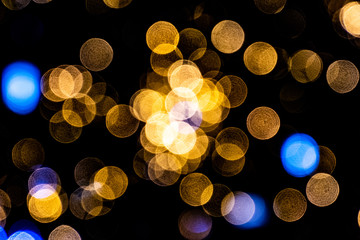 interesting original black background blurred with golden and blue light effect for christmas