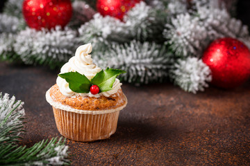 Christmas festive cupcake with holly leaves