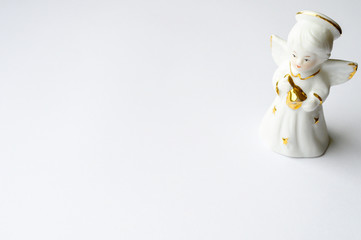 Ceramic angel figurine on a white background