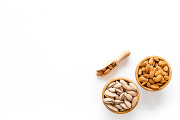 Almond in bowls for cooking on white background top view mockup