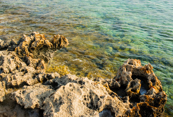 beautiful view of the sea and rocks off the coast of Cyprus, Ayia Napa, bathed in the morning sun