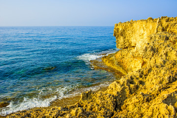 beautiful view of the sea and rocks off the coast of Cyprus, Ayia Napa, bathed in the morning sun