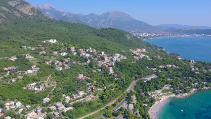 Flying over the seacoast to the turquoise sea