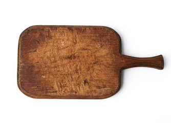 very old vintage cutting board with a handle made of oak