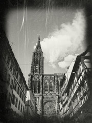 Vintage effect with frame over vertical image of Iconic Strasbourg Cathedral or the Cathedral of Our Lady of Strasbourg, also known as Strasbourg Minster the Catholic cathedral blue sky in the