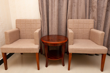 seats and table in a hotel room
