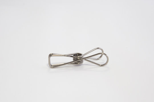 Stainless steel clothes pegs. Another easy way to reduce plastic waste from your household.  Strong, durable and compact so easy to store in laundry. Budget and eco friendly. Sustainability concept.