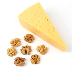 cheese and walnuts on a white background
