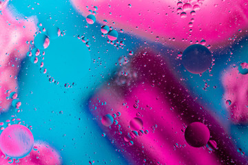 Micro molecular abstract pattern of colored oil bubbles on water. 