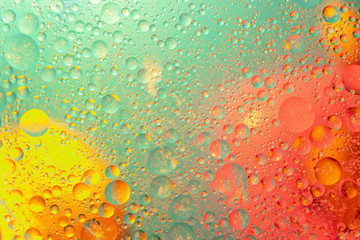 Oil drops in water abstract psychedelic pattern image. Abstract background with colorful gradient...