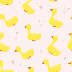 Seamless pattern with cute and funny ducks and hearts on pink background.