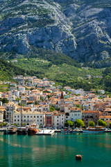 Fototapeta na wymiar View of the resort town of Makarska on a summer day, in Makarska Riviera, Croatia