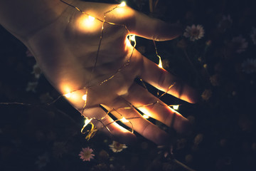 Fairy Lights On Hand Abstract Fantasy Background,Close-up Of hands