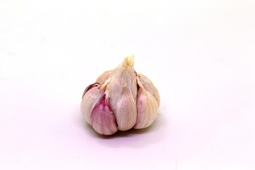 Garlic on a white background, used for cooking, universal food