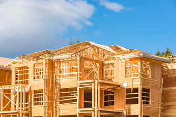 New apartment building under construction on blue sky background