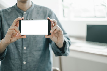Mockup image of engineers showing smartphone design building Project in office, mockup concept